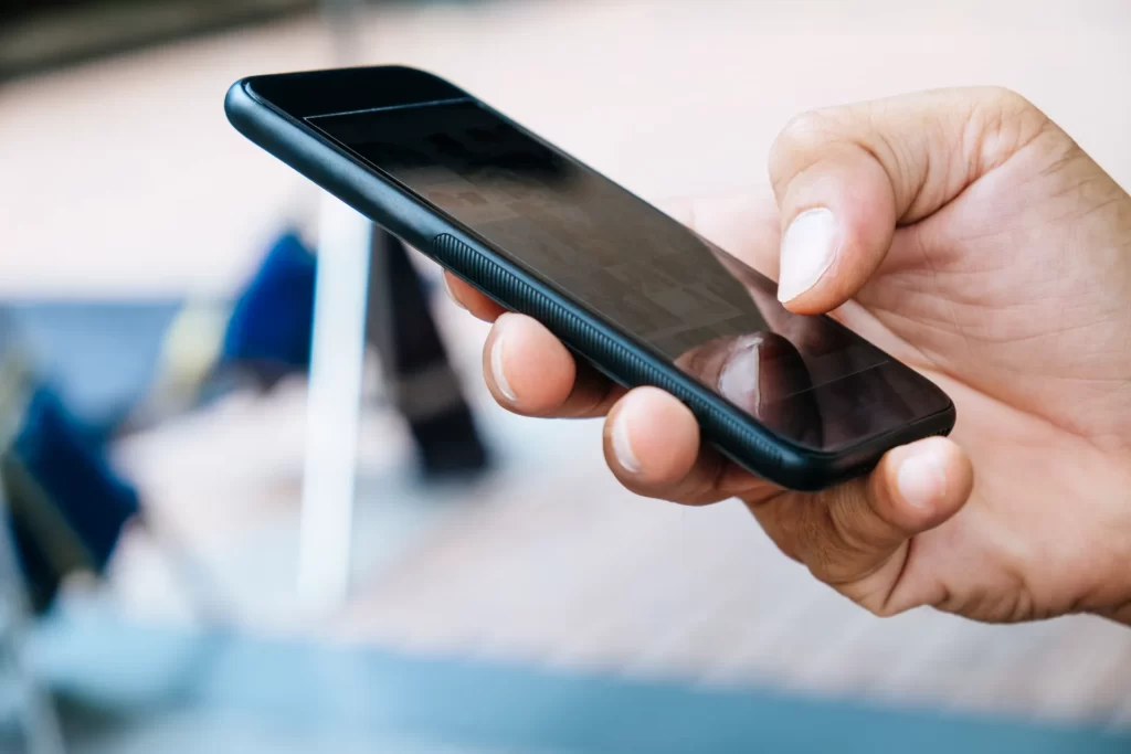 close up image of using phone utc