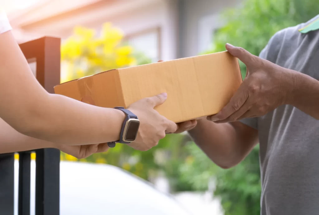 package delivery at a suburban home during daytime utc