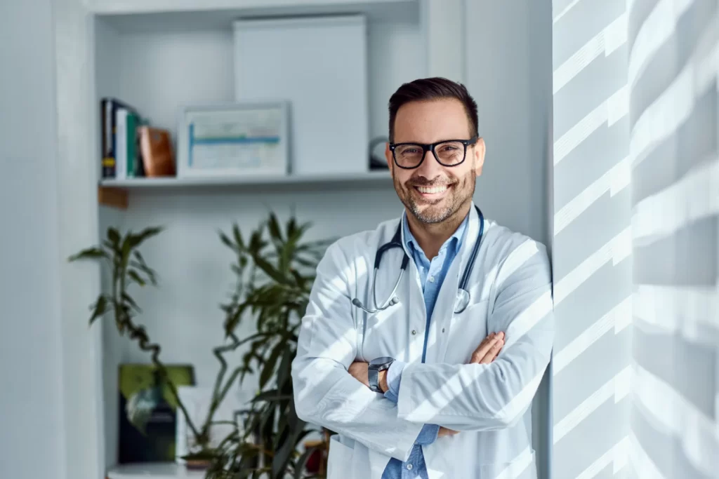 Licensed provider smiling in a clinical setting